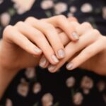 gray-nail-design-female-hand-with-glitter-manicure-min-scaled.jpg